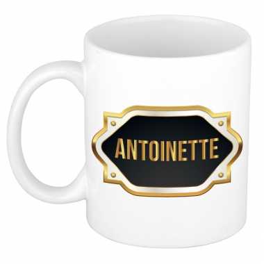 Naam cadeau mok / beker antoinette met gouden embleem 300 ml